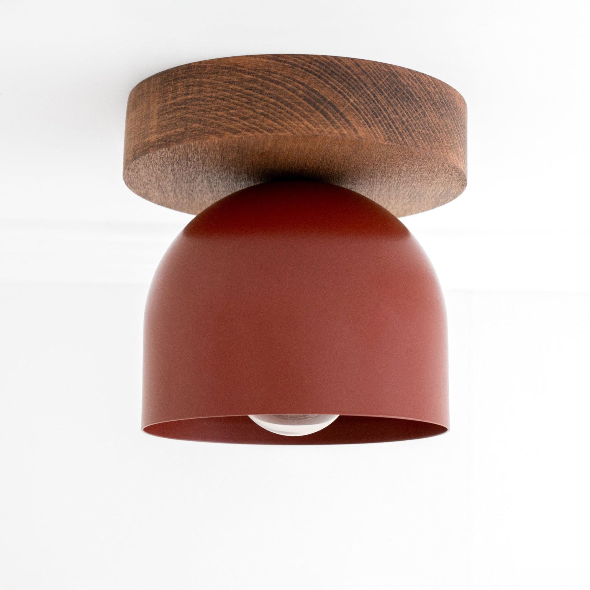 Flush mount ceiling light with oak finish base and brick red matte dome shade. - CEILING LIGHT MODEL NO. 1107