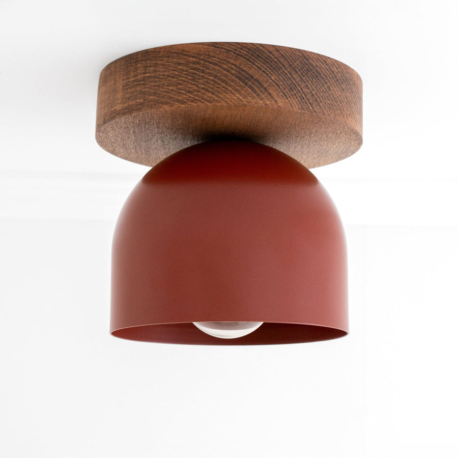 Flush mount ceiling light with oak finish base and brick red matte dome shade. - CEILING LIGHT MODEL NO. 1107