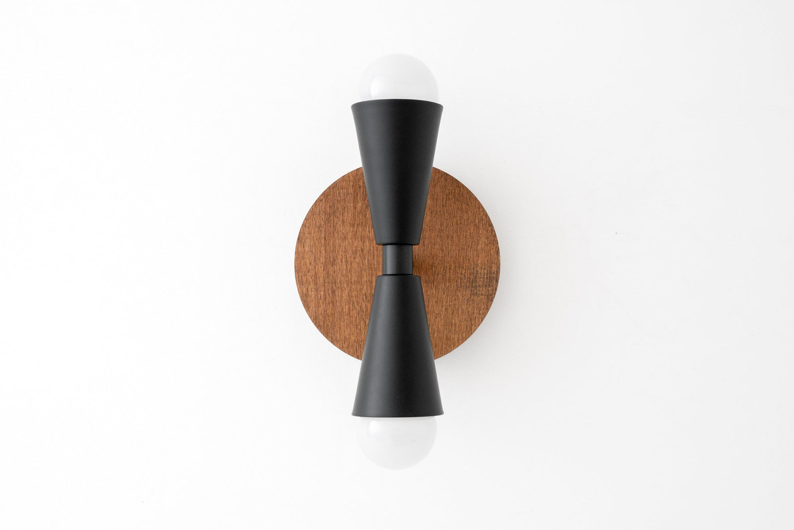 Scandinavian-style black metal double cone sconce with oak wood round backplate and exposed bulbs. - SCONCE MODEL NO. 4717