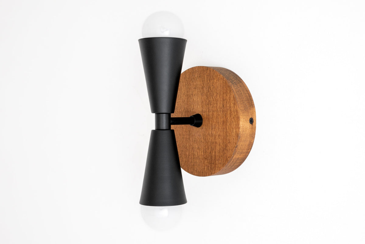 Black metal double cone wall sconce with exposed bulbs and round oak wood base. - SCONCE MODEL NO. 4717
