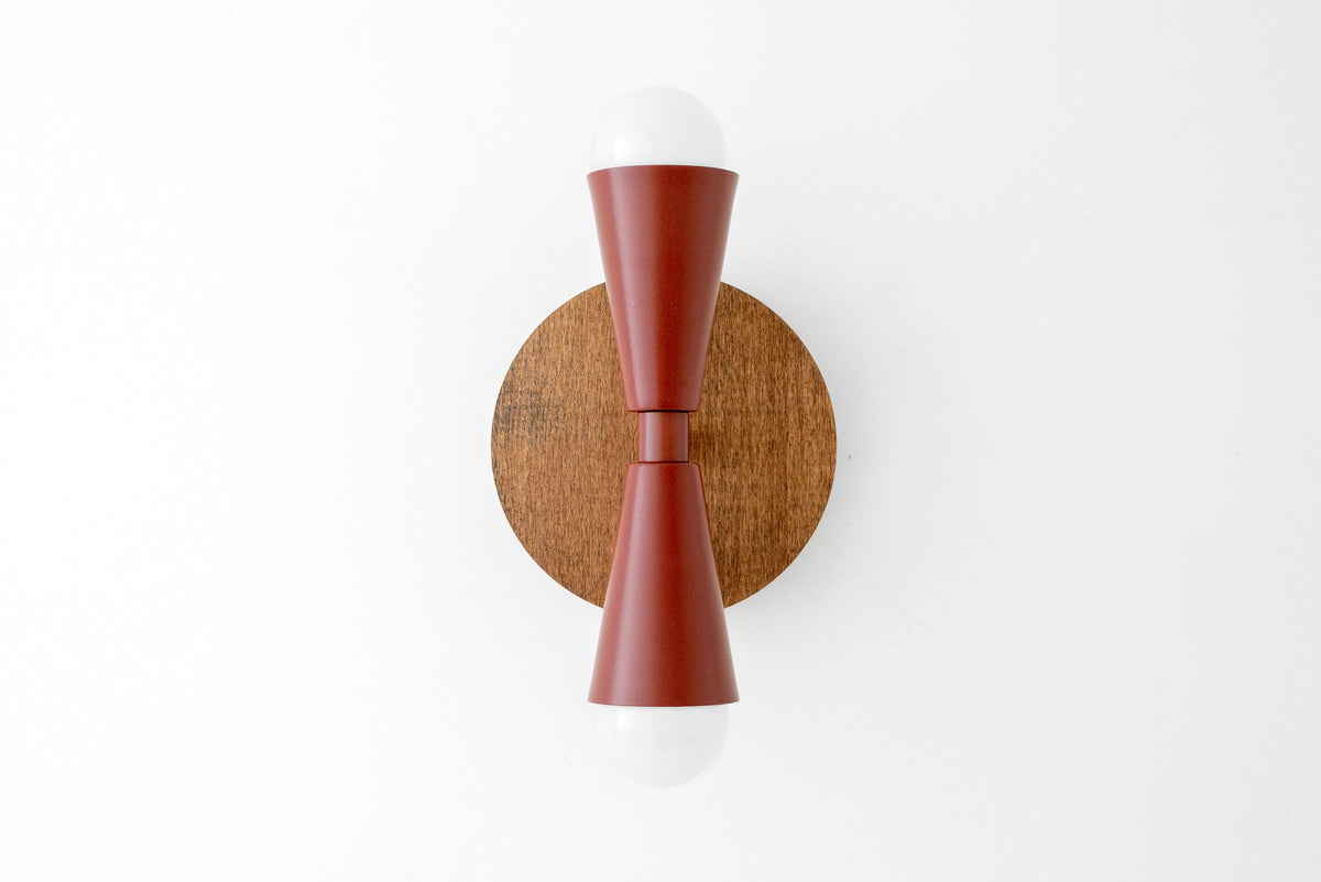 Scandinavian-style wood wall sconce with brick red double cone shades and bare bulbs on round oak backplate. - SCONCE MODEL NO. 4717