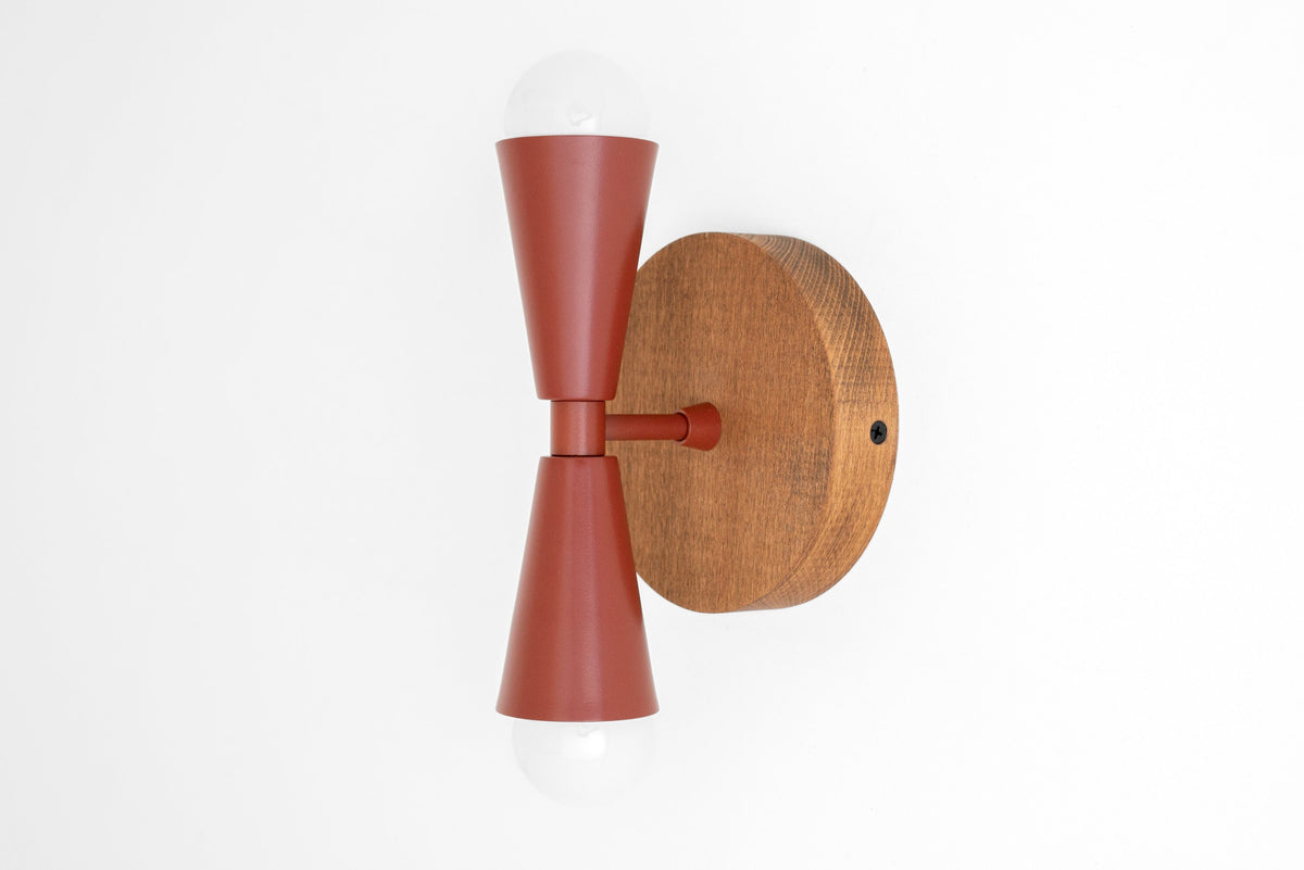 Boho-style wall sconce with oak wood base and brick red metal double cone shades with exposed bulbs. - SCONCE MODEL NO. 4717