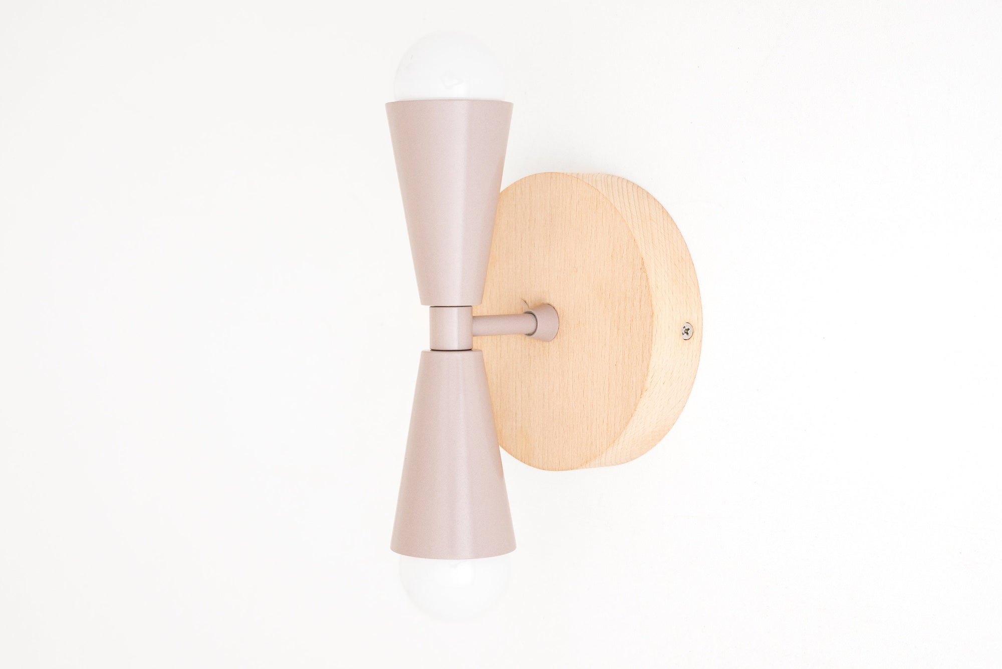 Scandinavian-style wall sconce with beechwood base and mauve double cone shades, bare bulbs exposed. - SCONCE MODEL NO. 4717