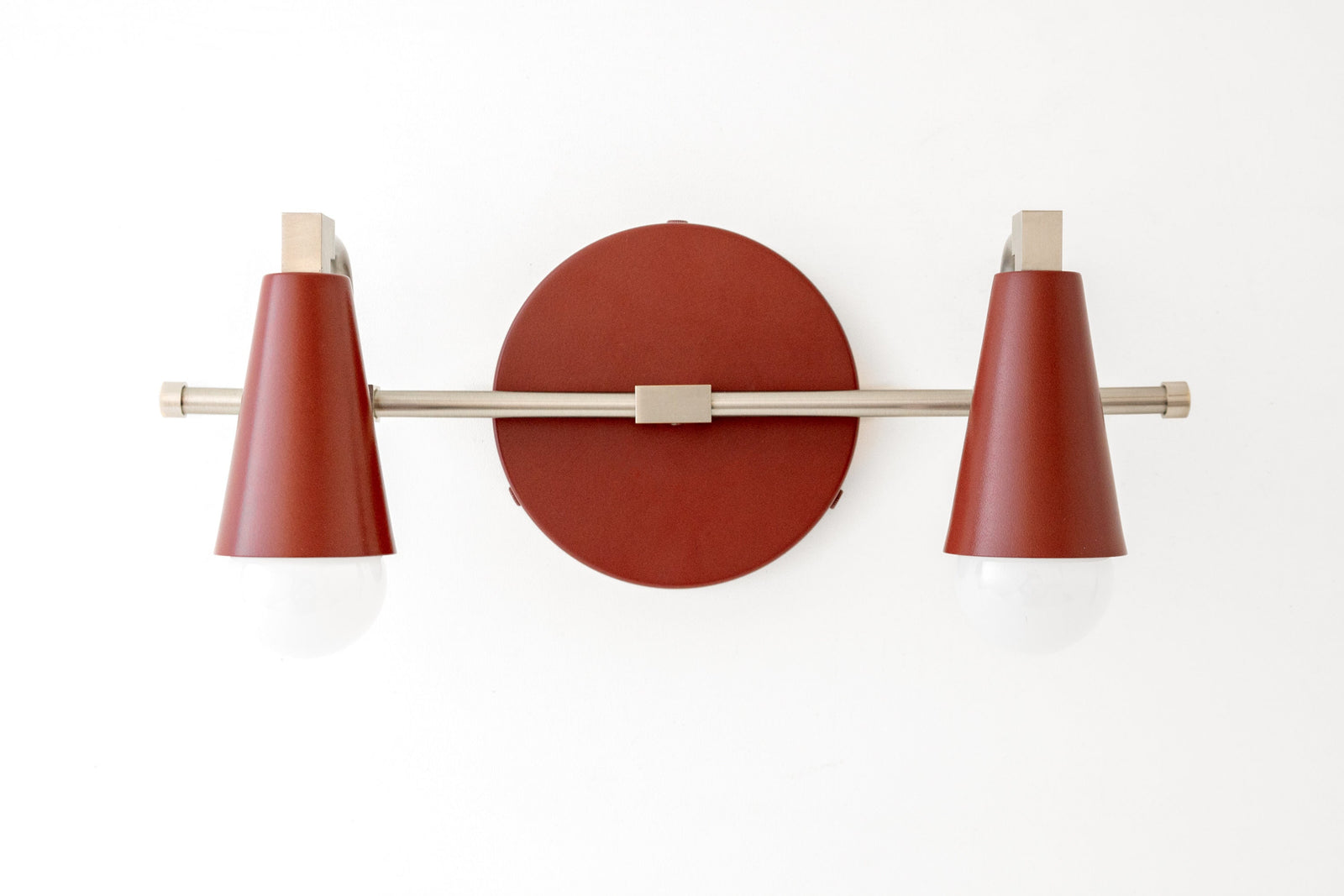Brushed nickel vanity light with two brick red conical shades and bare bulbs. - VANITY LIGHT MODEL NO. 1229