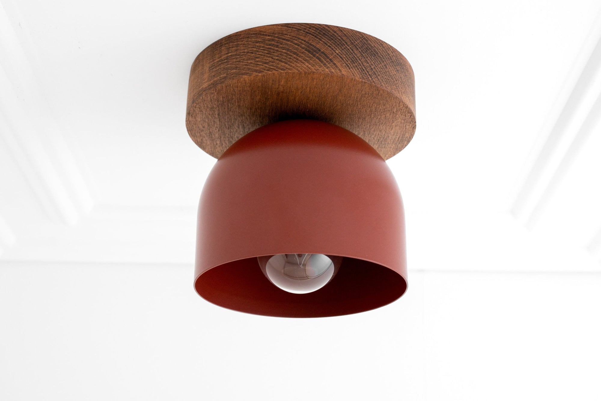 Flush mount ceiling light with oak wood base and brick red metal shade revealing exposed bulb. - CEILING LIGHT MODEL NO. 1107