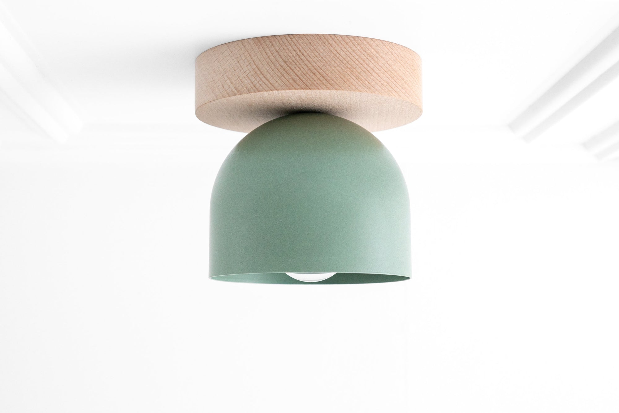 Flush mount ceiling light with natural beechwood base and matte green dome shade. - CEILING LIGHT MODEL NO. 1107