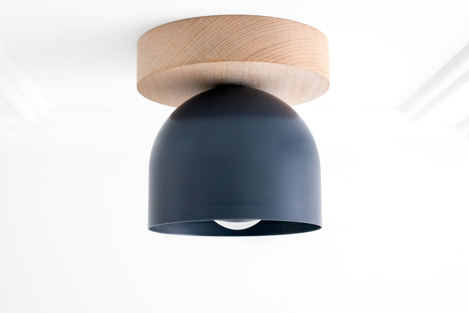 Flush mount ceiling light with natural beechwood base and matte black dome shade. - CEILING LIGHT MODEL NO. 1107