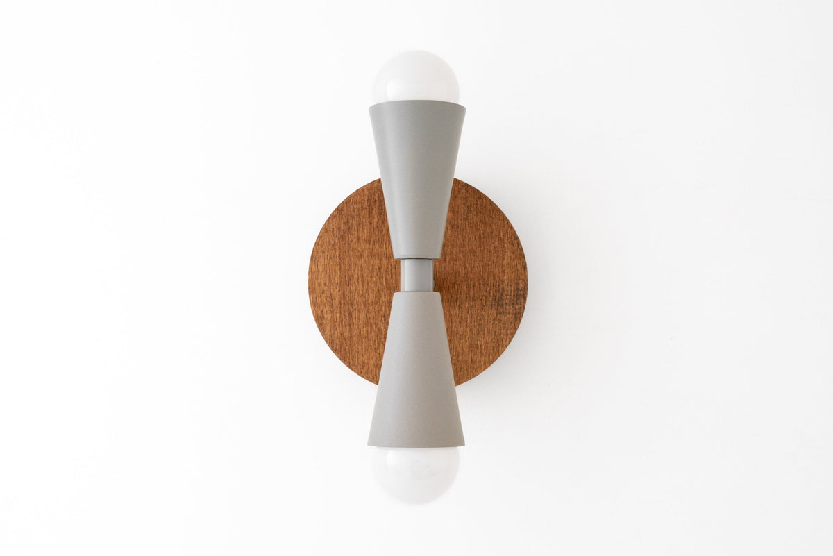 Scandinavian style wall sconce with oak wood backplate and gray double cone metal arms holding exposed bulbs. - SCONCE MODEL NO. 4717
