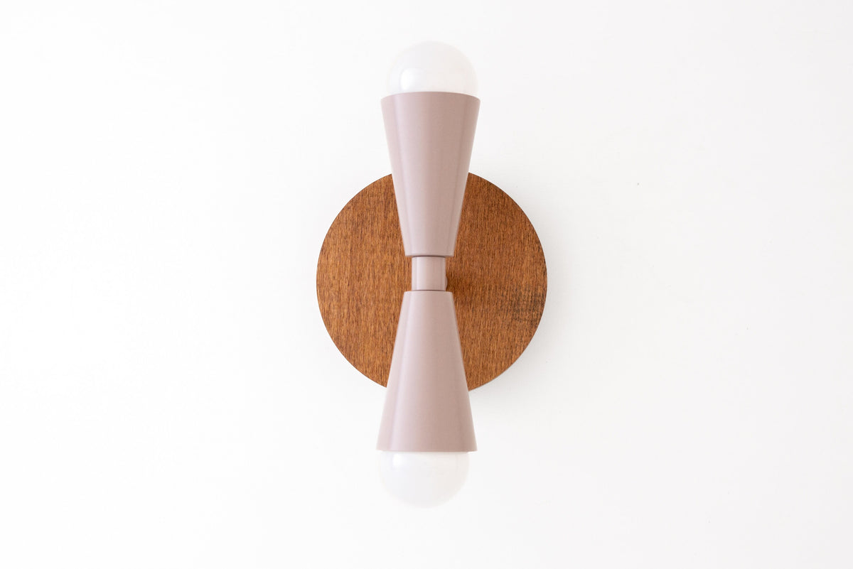Boho-style oak finish sconce with mauve tapered wooden fixture and bare bulbs on top and bottom. - SCONCE MODEL NO. 4717