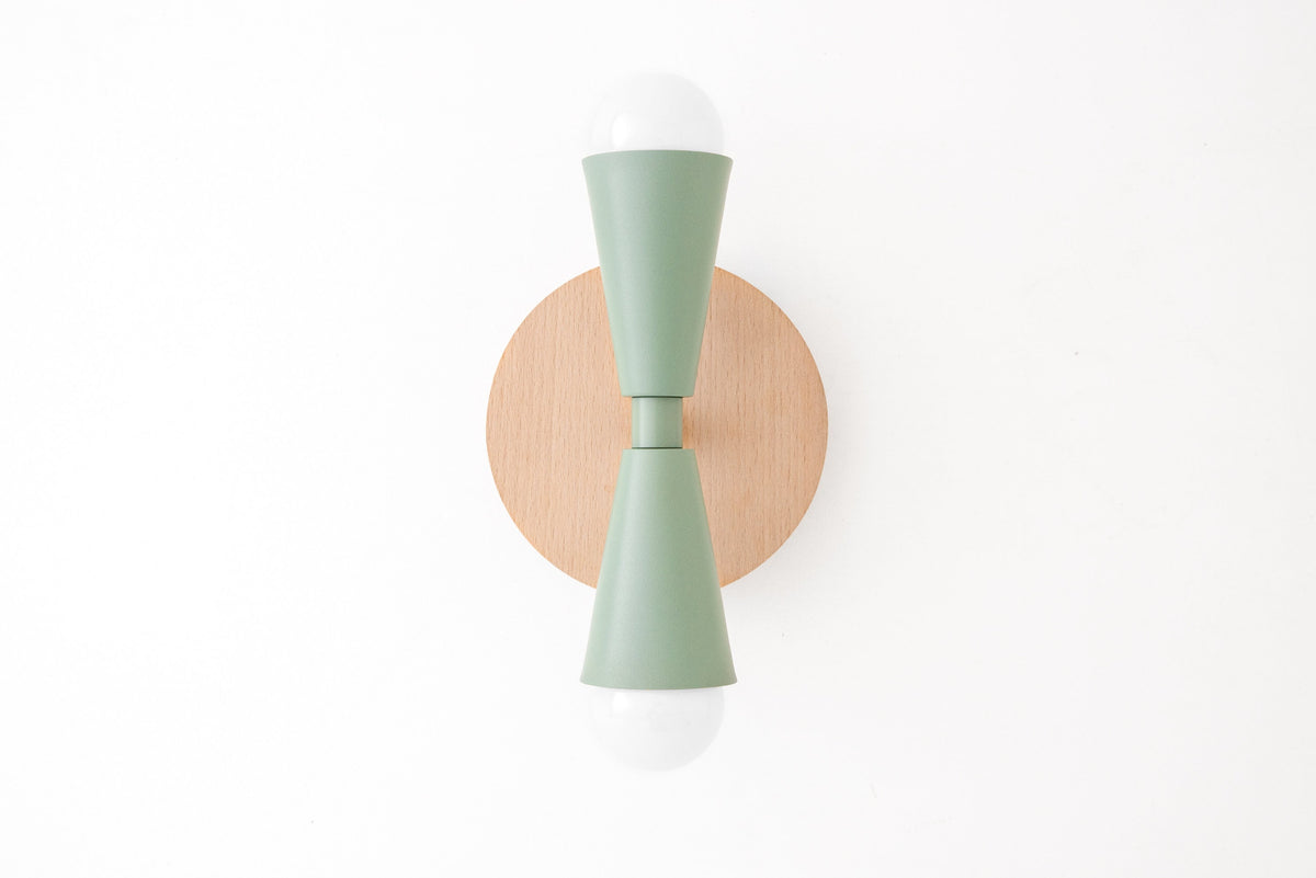 Scandinavian-style beechwood sconce with matte green double-cone metal shade and exposed white bulbs. - SCONCE MODEL NO. 4717