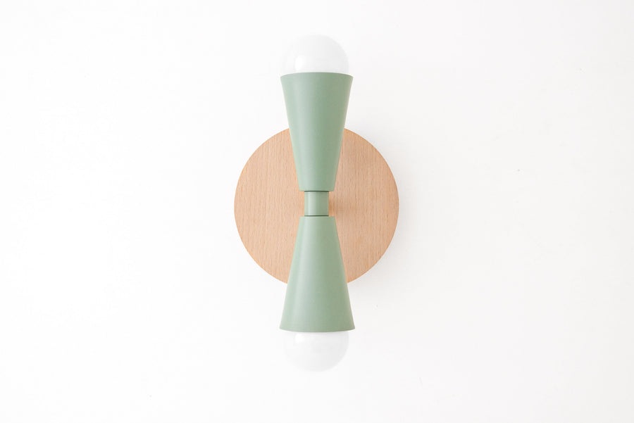 Scandinavian-style beechwood sconce with matte green double-cone metal shade and exposed white bulbs. - SCONCE MODEL NO. 4717