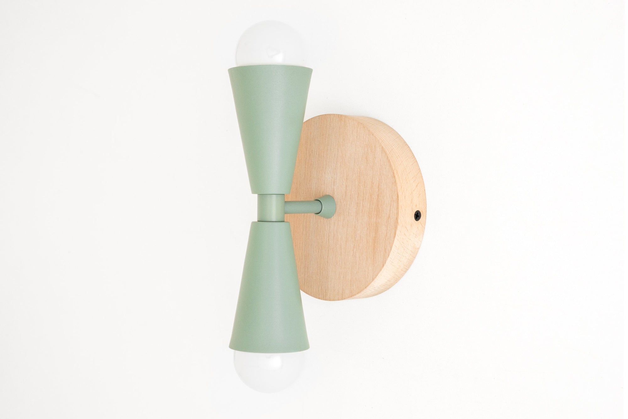 Scandinavian style wall sconce with natural beechwood round base and matte green double cone metal shades with exposed bulbs. - SCONCE MODEL NO. 4717