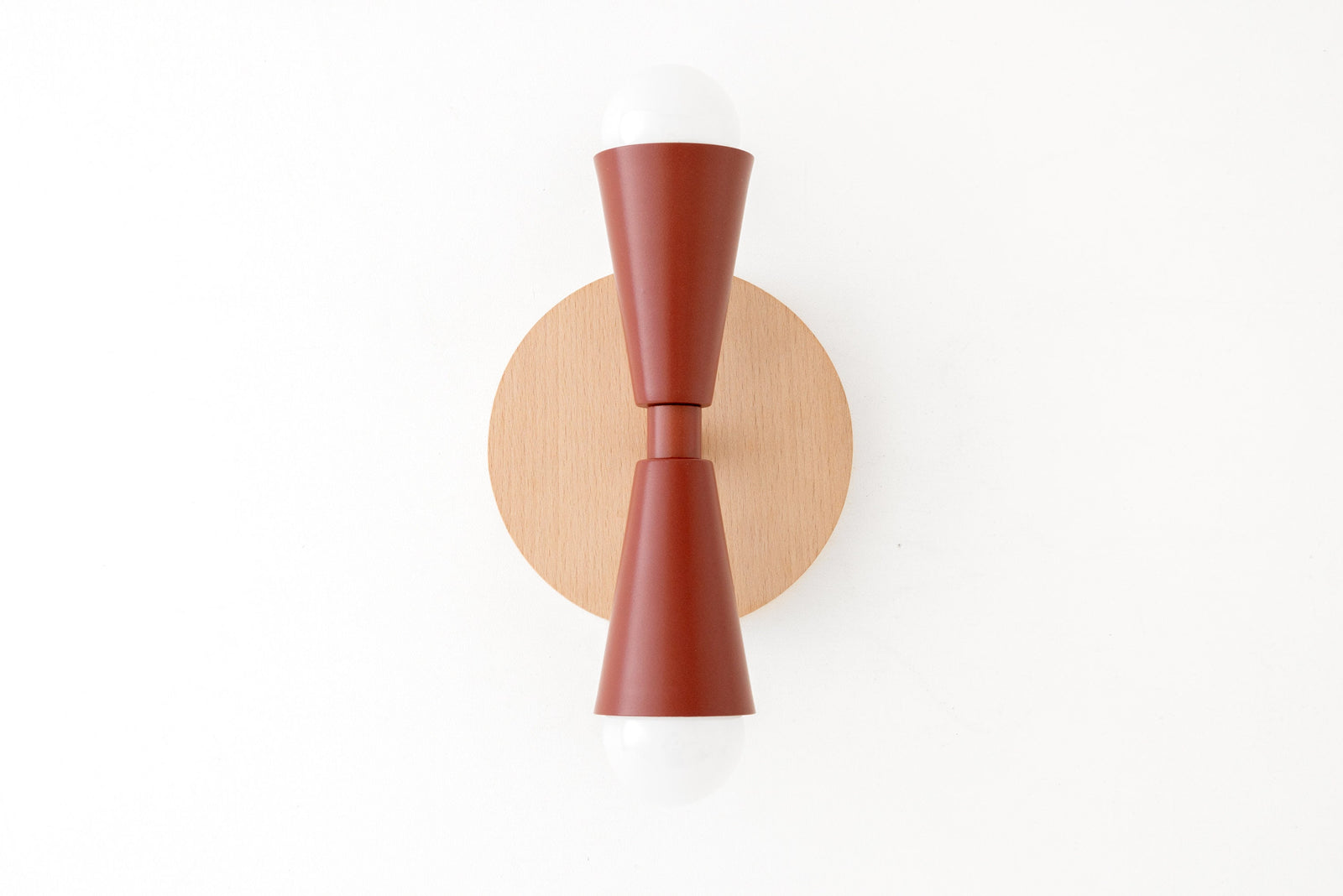 Scandinavian style sconce with beechwood round base and brick red double cone shade with exposed bulbs. - SCONCE MODEL NO. 4717
