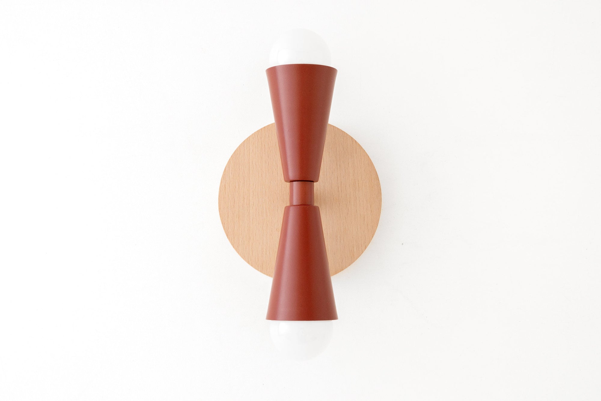 Scandinavian style sconce with beechwood round base and brick red double cone shade with exposed bulbs. - SCONCE MODEL NO. 4717