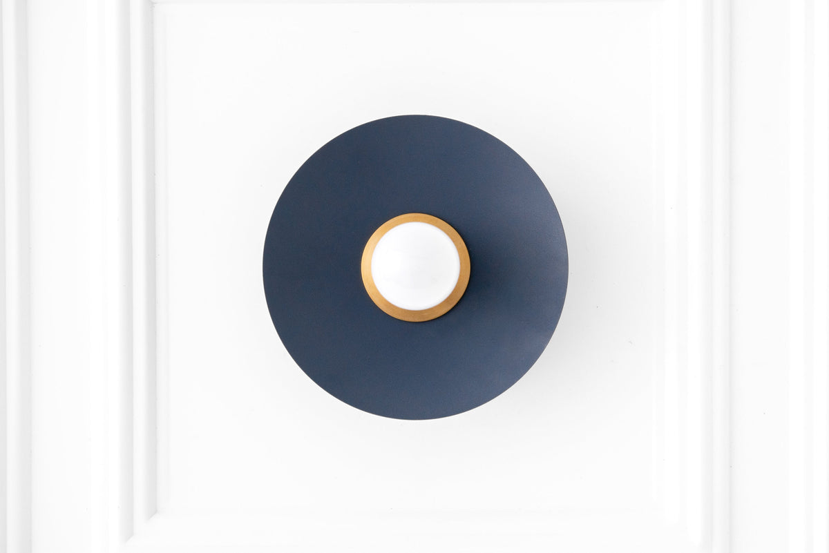 Raw brass and coal blue Scandinavian flush sconce with exposed bulb and minimalist design. - SCONCE MODEL NO. 9660