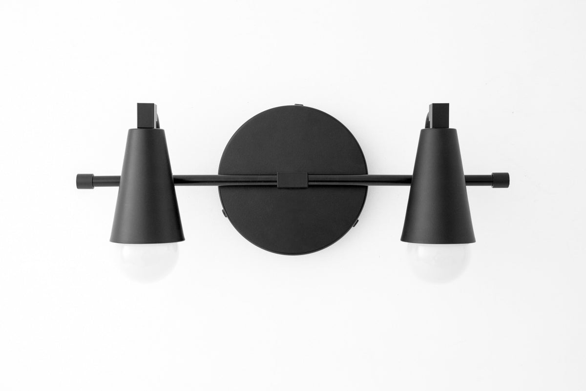 Black industrial two-bulb vanity light with conical shades and round wall mount. - VANITY LIGHT MODEL NO. 1229