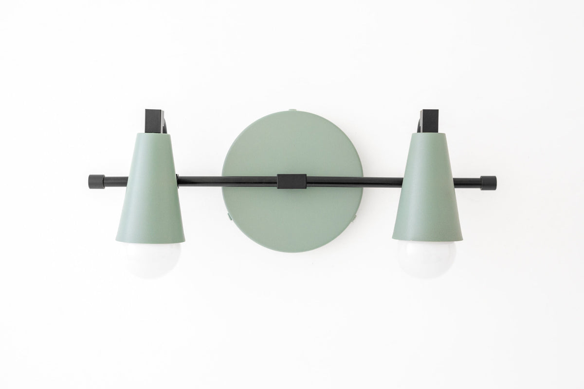 Industrial style vanity light with two mint green conical shades and matte black metal accents. - VANITY LIGHT MODEL NO. 1229