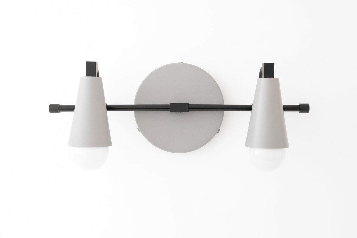 Black and gray industrial-style 2-bulb vanity light with conical shades and round wall mount. - VANITY LIGHT MODEL NO. 1229