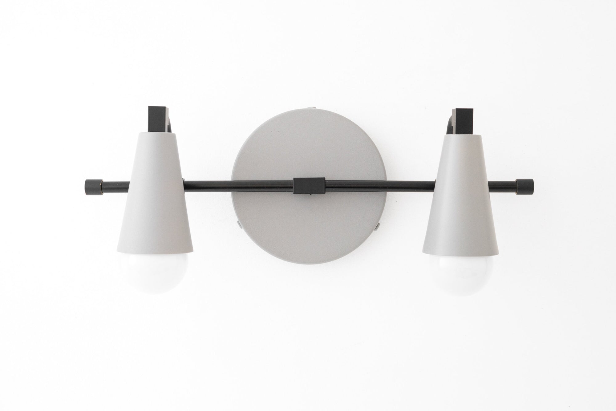 Black and gray industrial-style 2-bulb vanity light with conical shades and round wall mount. - VANITY LIGHT MODEL NO. 1229