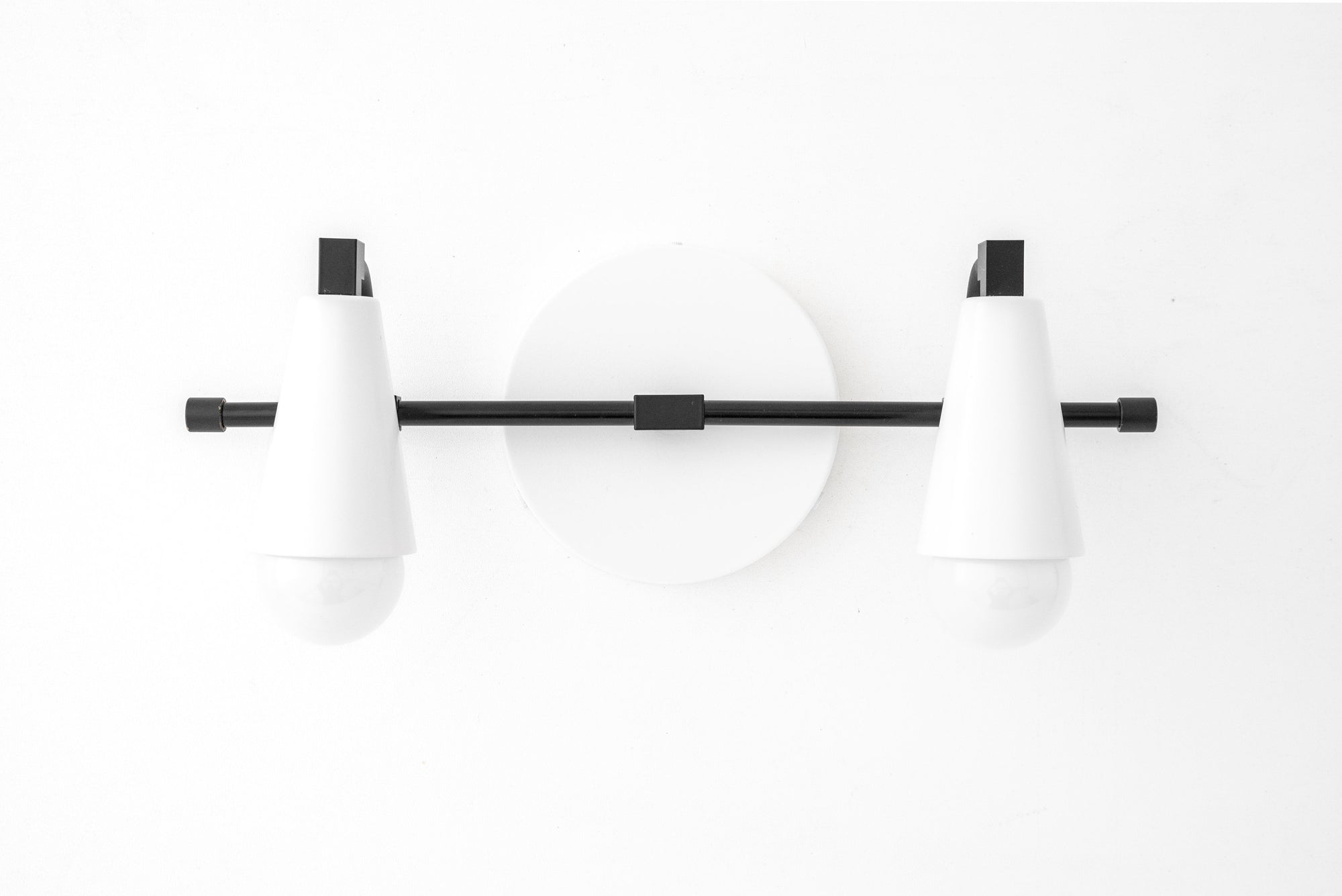 Black and white industrial 2-bulb vanity light with conical shades and a round wall mount. - VANITY LIGHT MODEL NO. 1229