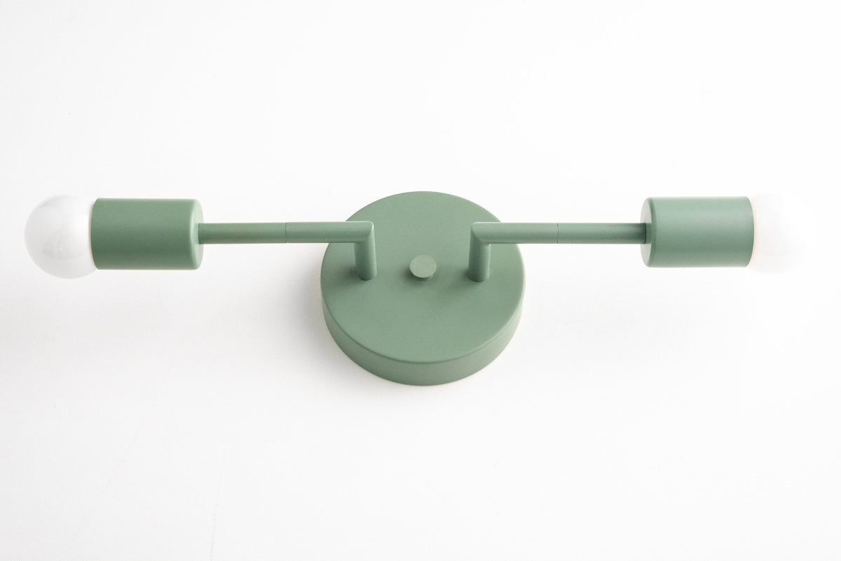 Mid-century modern green vanity light with two bare bulbs and round wall mount. - VANITY LIGHT MODEL NO. 1938