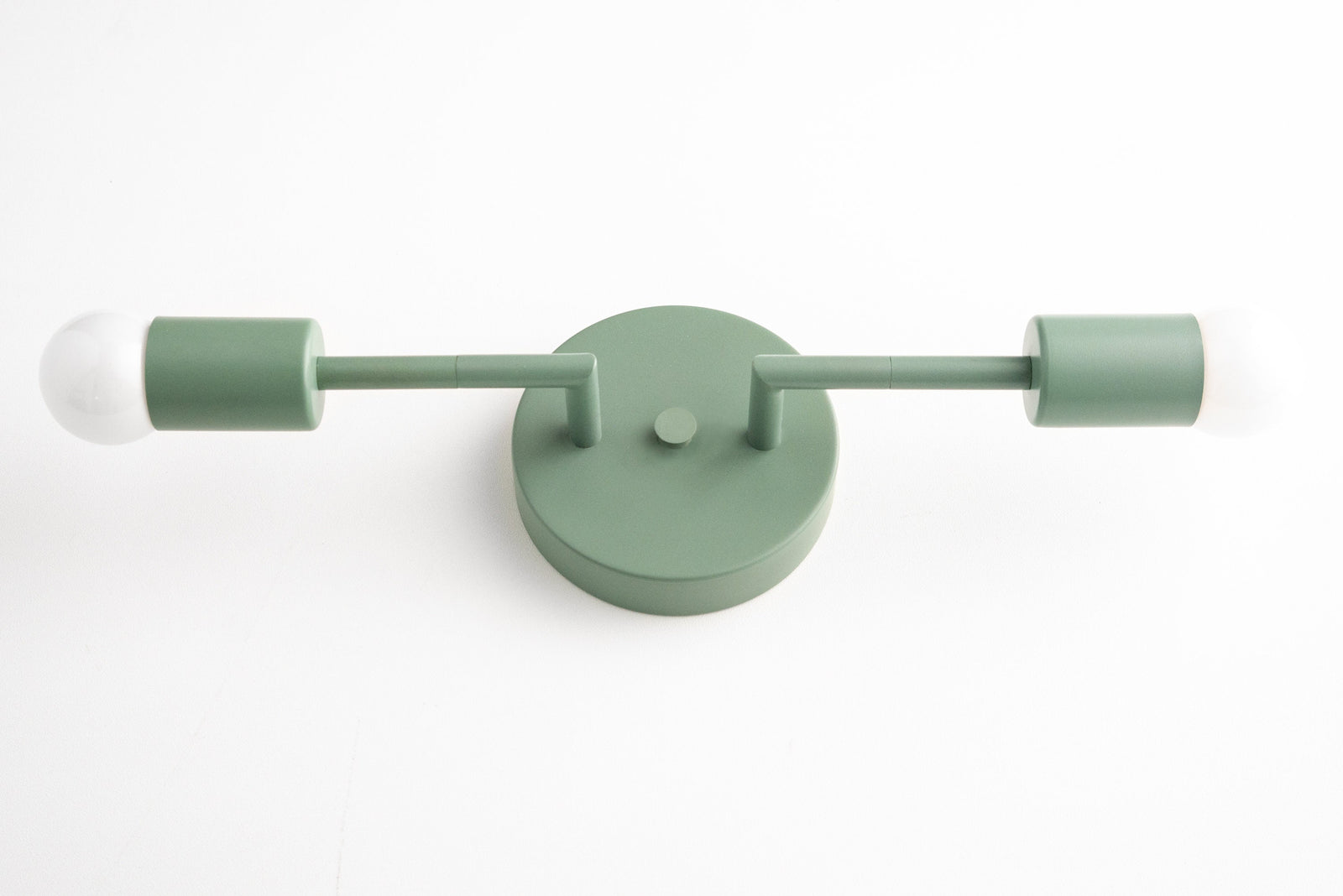 Mid-century modern green vanity light with two bare bulbs and round wall mount. - VANITY LIGHT MODEL NO. 1938