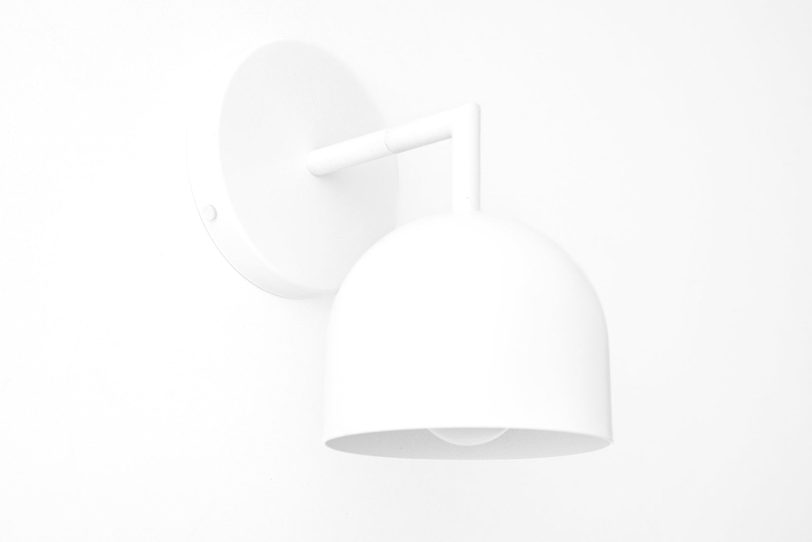 White matte metal Scandinavian-style wall sconce with dome-shaped shade and exposed bulb design. - SCONCE MODEL NO. 4250