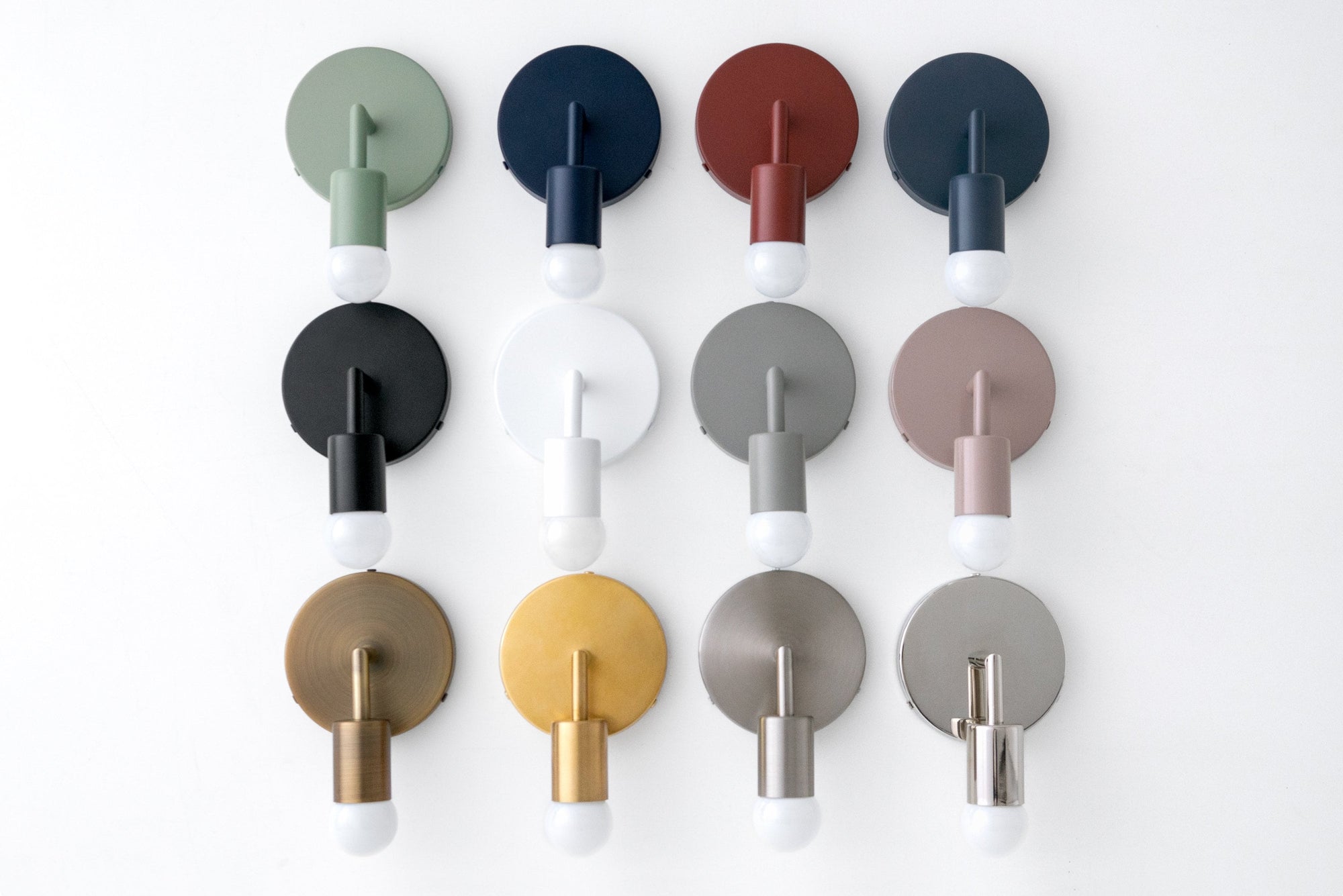 Collection of Scandinavian-style wall sconces in various colors including green, coal blue, brick red, black, white, mauve,. - SCONCE MODEL NO. 5480