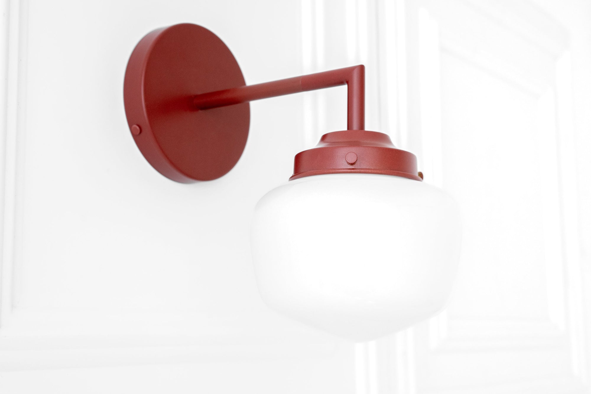 Brick red Art Deco semi-flush wall sconce with round backplate and white globe shade. - SCONCE MODEL NO. 4260