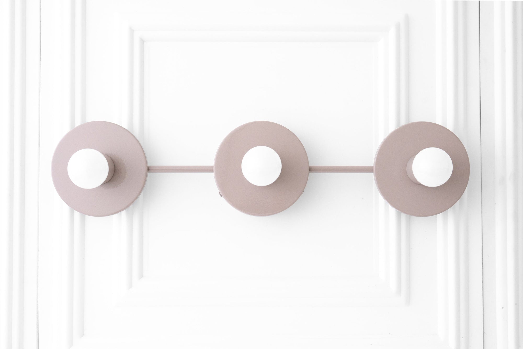 Mid-century modern mauve vanity light with three round bases and exposed white bulbs. - VANITY LIGHT MODEL NO. 5708