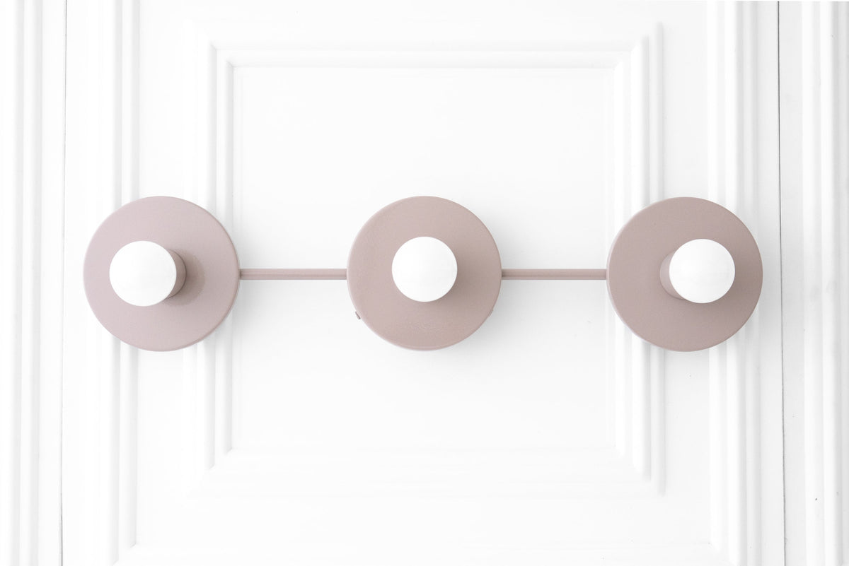 Mauve Scandinavian vanity light with three round bare bulbs on a linear mount. - VANITY LIGHT MODEL NO. 5708