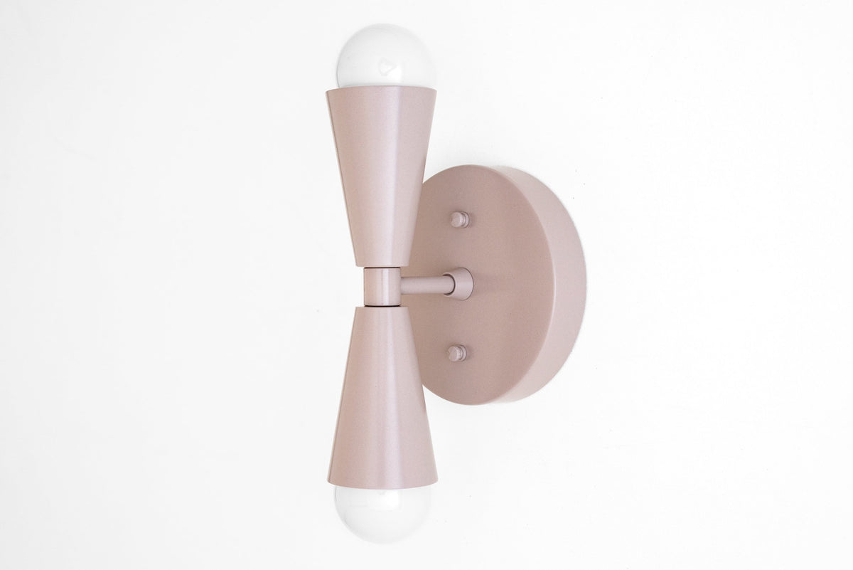 Mauve Art Deco sconce with dual cone-shaped shades and exposed bulbs, wall-mounted design. - SCONCE MODEL NO. 4717