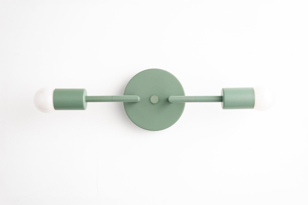 Mid-century modern green two-bulb vanity light with matte finish and round wall mount. - VANITY LIGHT MODEL NO. 1938