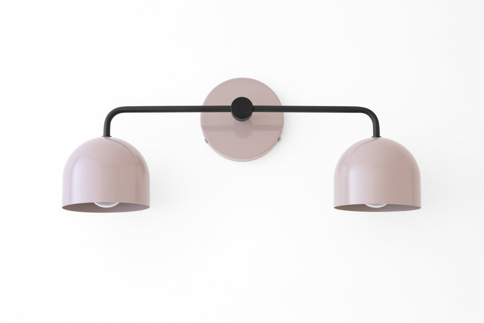 Scandinavian-style black metal vanity light with two soft mauve dome shades and round wall mount. - VANITY LIGHT MODEL NO. 2082