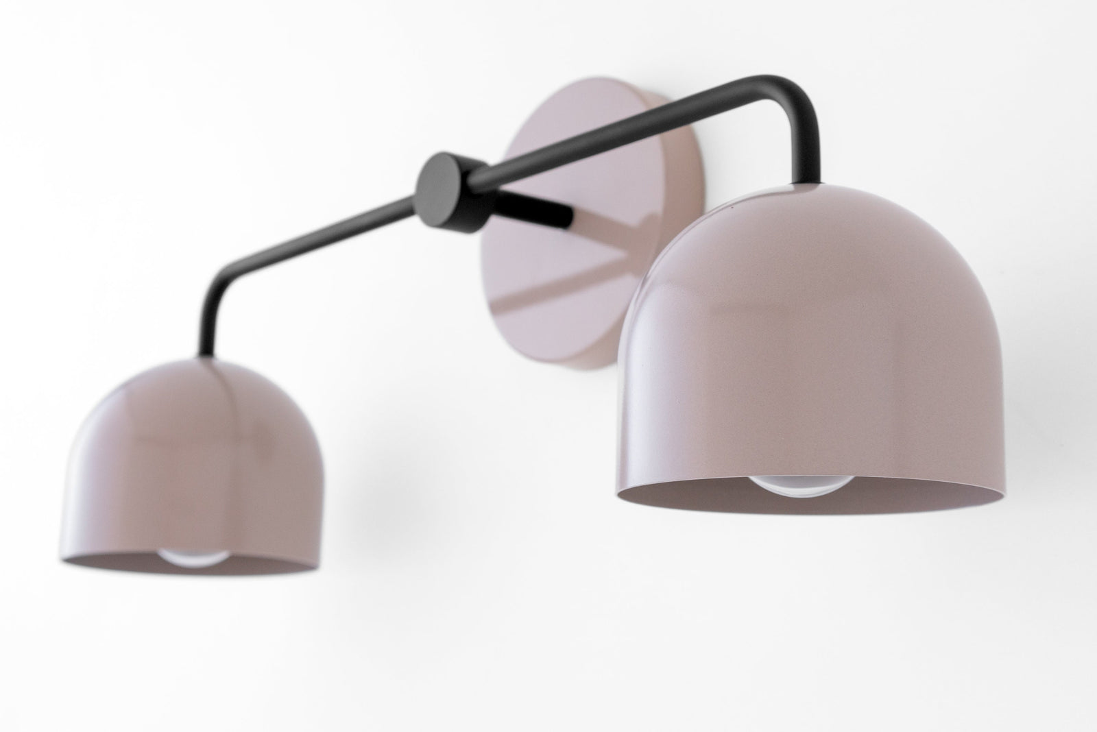 Mid-century modern black vanity light with two mauve dome shades and wall mount plate. - VANITY LIGHT MODEL NO. 2082