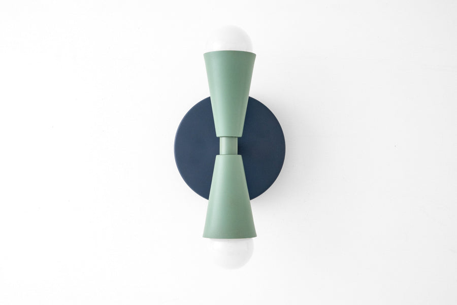 Art Deco style sconce with coal blue circular backplate and matte green double cone arms holding bare bulbs up and down. - SCONCE MODEL NO. 4717