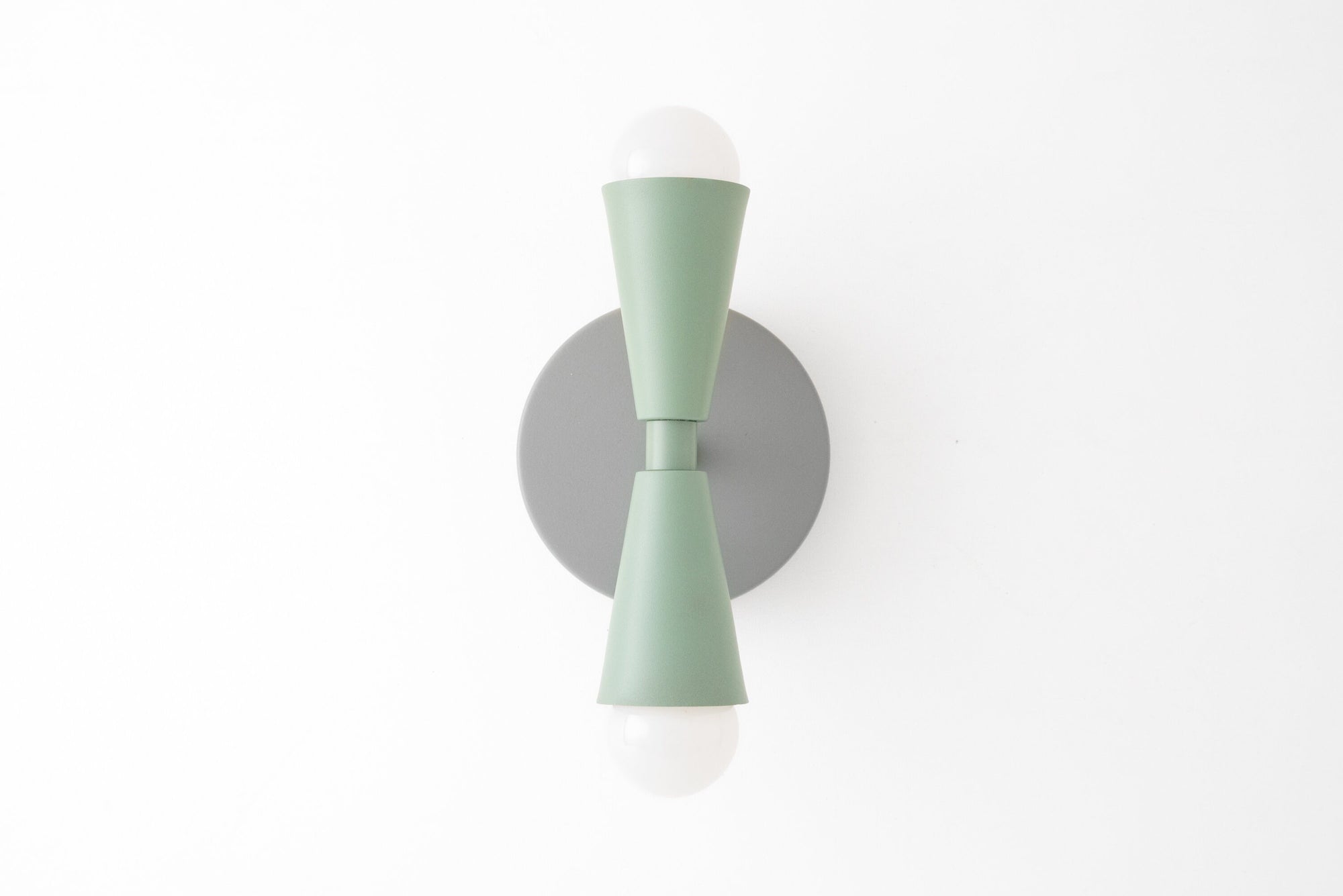 Art Deco style mint green semi-flush wall sconce with up/down bare bulbs and round gray backplate. - SCONCE MODEL NO. 4717