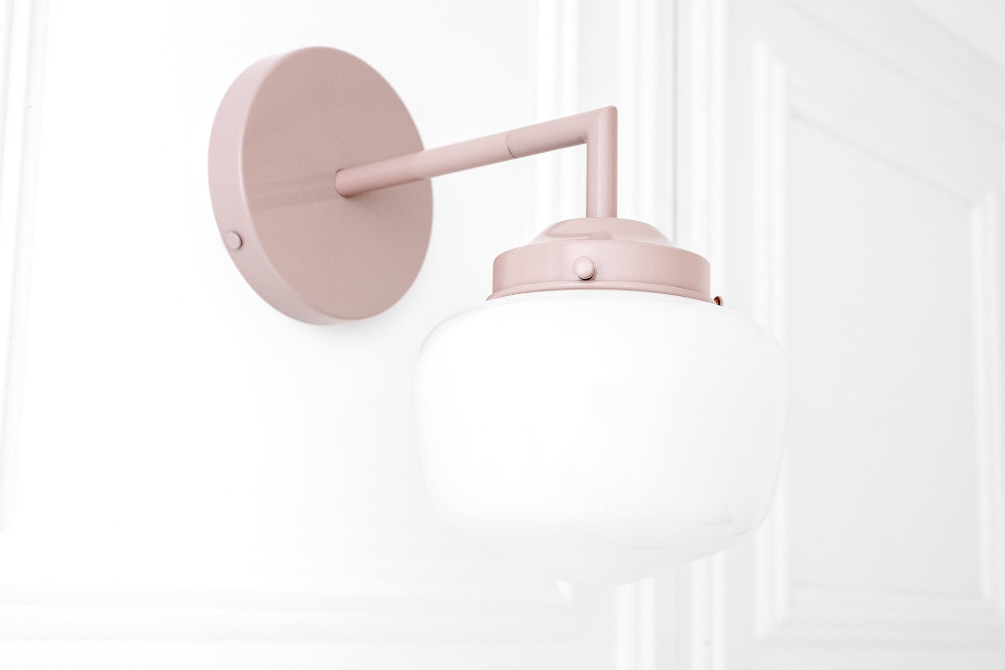 Art Deco mauve metal sconce with round wall plate and frosted white globe shade. - SCONCE MODEL NO. 4260