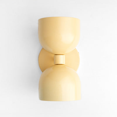 Mid-century modern yellow up/down wall sconce with smooth curved shade and matte finish. - SCONCE MODEL NO. 5641