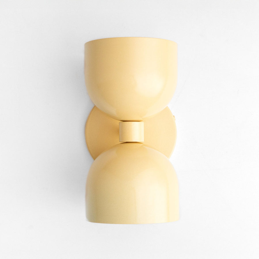 Mid-century modern yellow up/down wall sconce with smooth curved shade and matte finish. - SCONCE MODEL NO. 5641