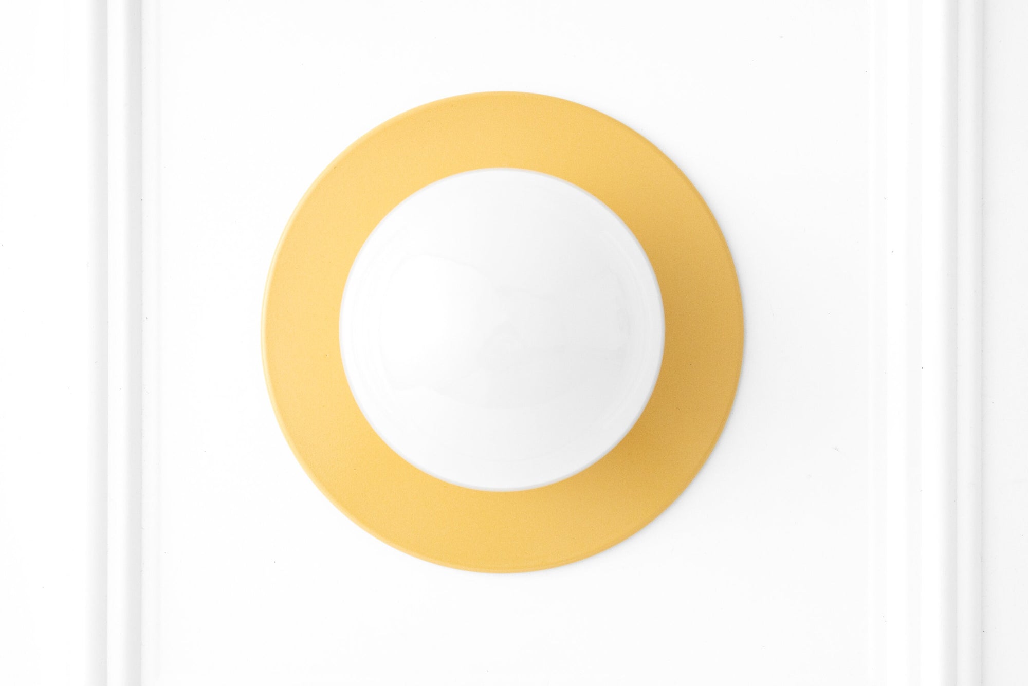 Wall-mounted round sconce with a white globe and a matte yellow circular base. - SCONCE MODEL NO. 2277