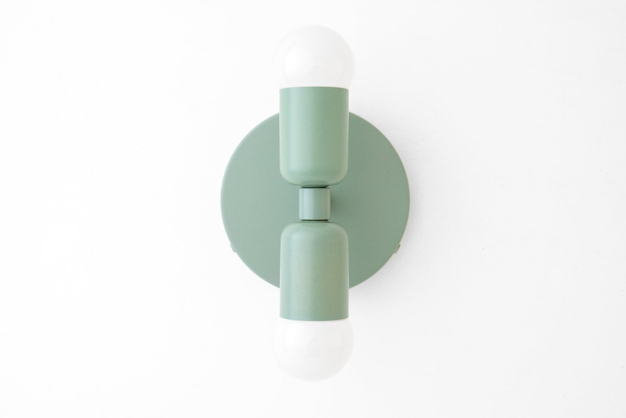 Mid-century modern green sconce with round backplate and exposed bulbs top and bottom. - SCONCE MODEL NO. 2660