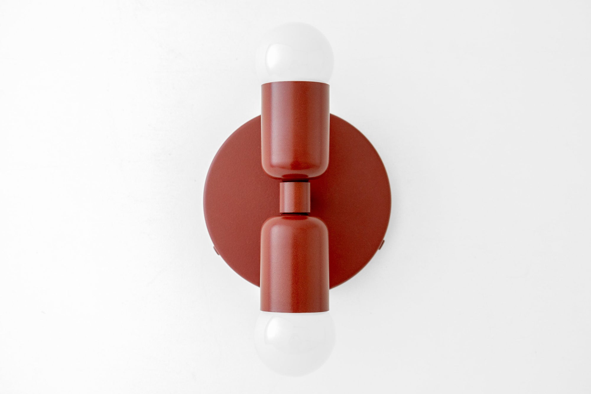 Mid-century modern red metal sconce with two white exposed bulbs up and down. - SCONCE MODEL NO. 2660