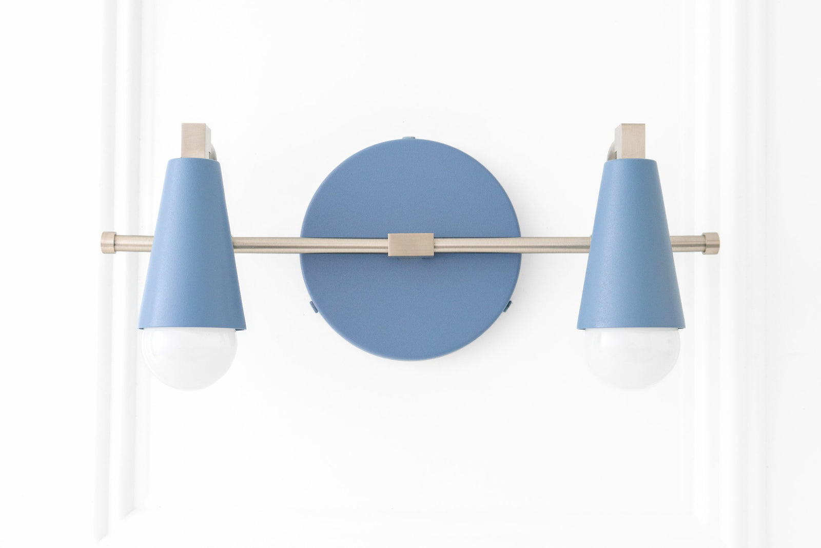 Scandinavian-style vanity light with two bare bulbs, powder blue conical shades, and brushed nickel finish. - VANITY LIGHT MODEL NO. 1229