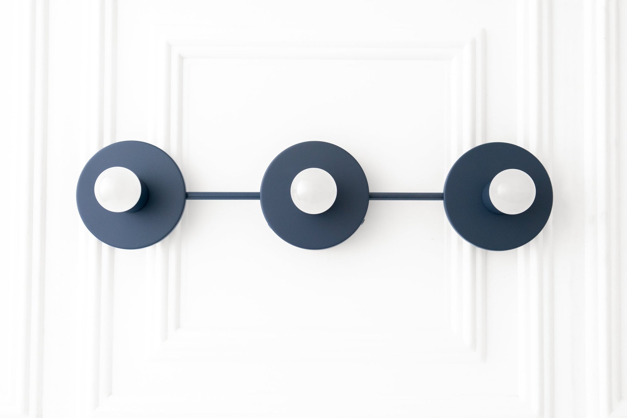 Matte black 3-bulb vanity light with circular backplates and exposed round bulbs. - VANITY LIGHT MODEL NO. 5708