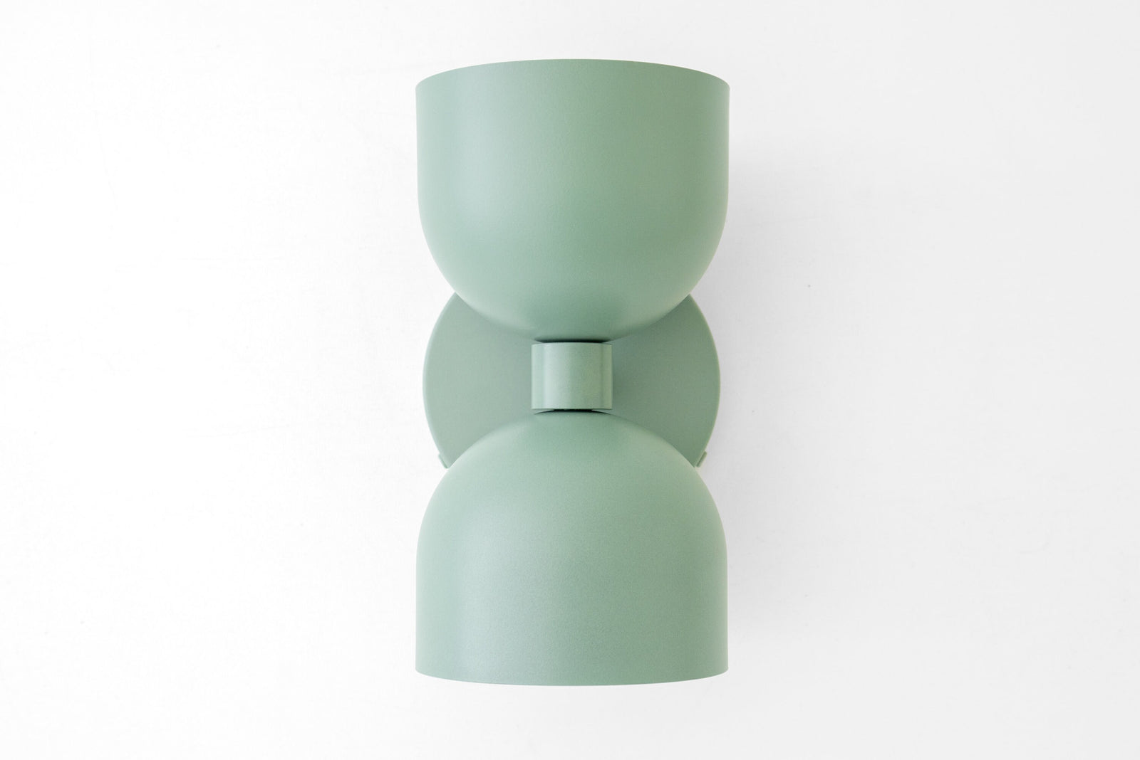 Mid-century modern matte sage green up/down wall sconce with smooth curves and cylindrical shade. - SCONCE MODEL NO. 5641