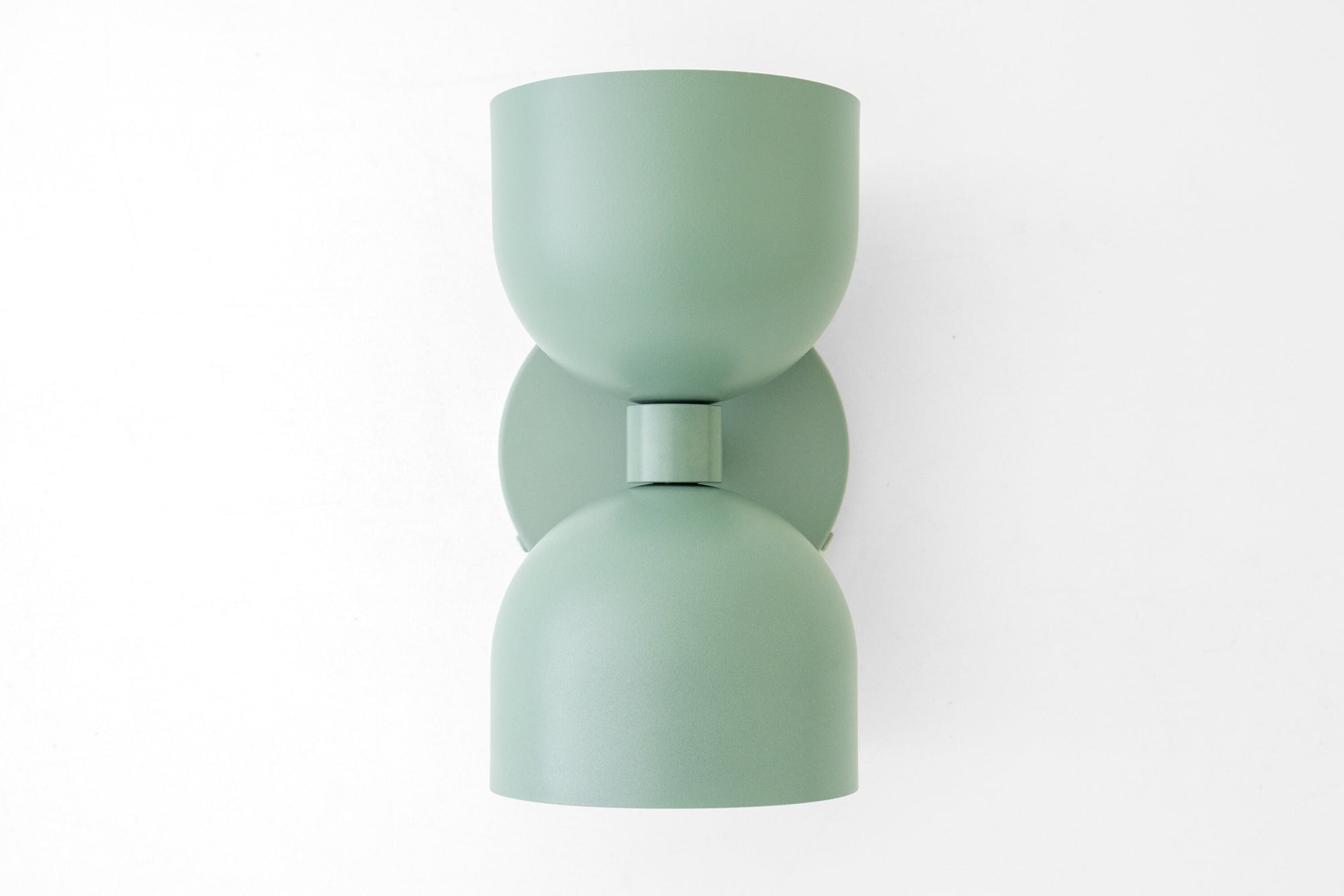 Mid-century modern matte sage green up/down wall sconce with smooth curves and cylindrical shade. - SCONCE MODEL NO. 5641