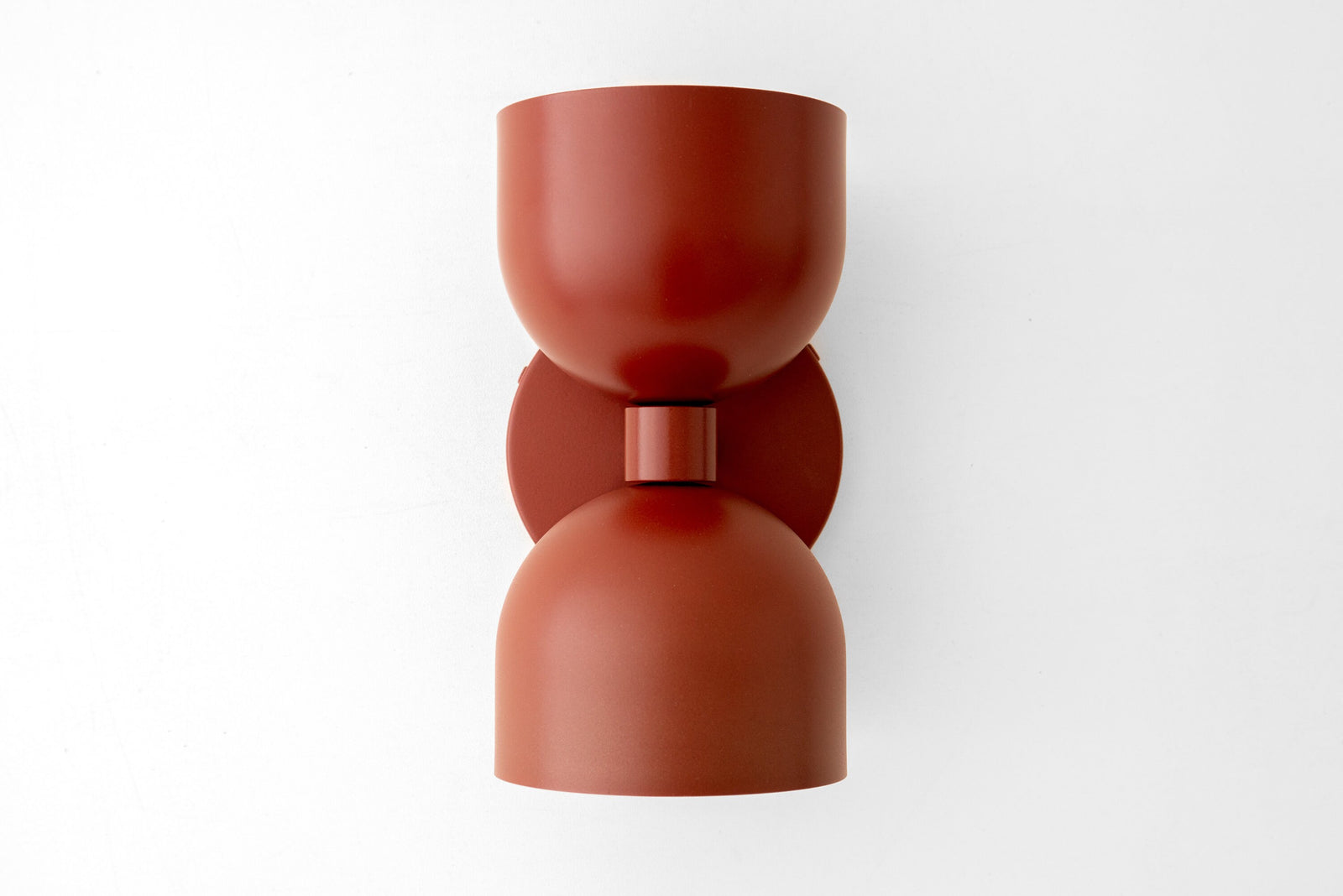 Mid-century modern brick red up/down metal wall sconce with smooth curved shade. - SCONCE MODEL NO. 5641