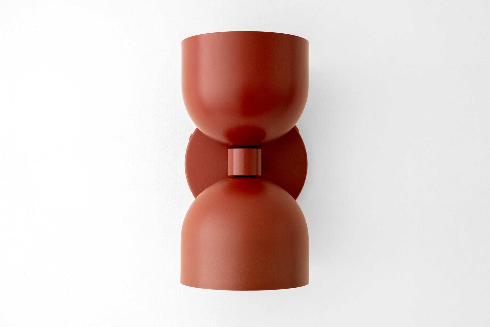 Mid-century modern brick red up/down metal wall sconce with smooth curved shade. - SCONCE MODEL NO. 5641