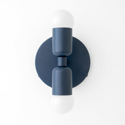 Mid-century modern coal blue metal sconce with up/down exposed white bulbs and circular backplate. - SCONCE MODEL NO. 2660
